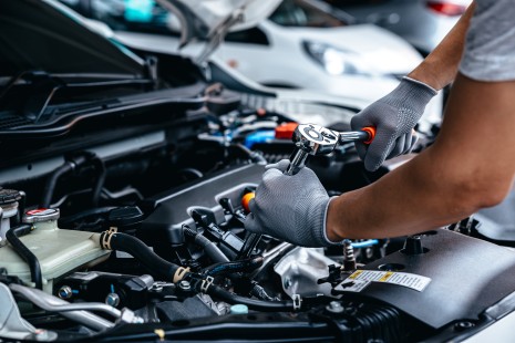 An AlloyGator Car Service mechanic doing a vehicle check, installing auto parts, car tuning and completing a service